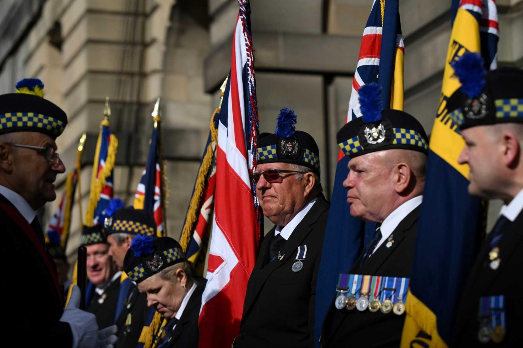 Veterans of the Royal British Legion of Scotland stand guard outside of the St Giles' Cathedral in Edinburgh on Sept 11. Photo: AFP 