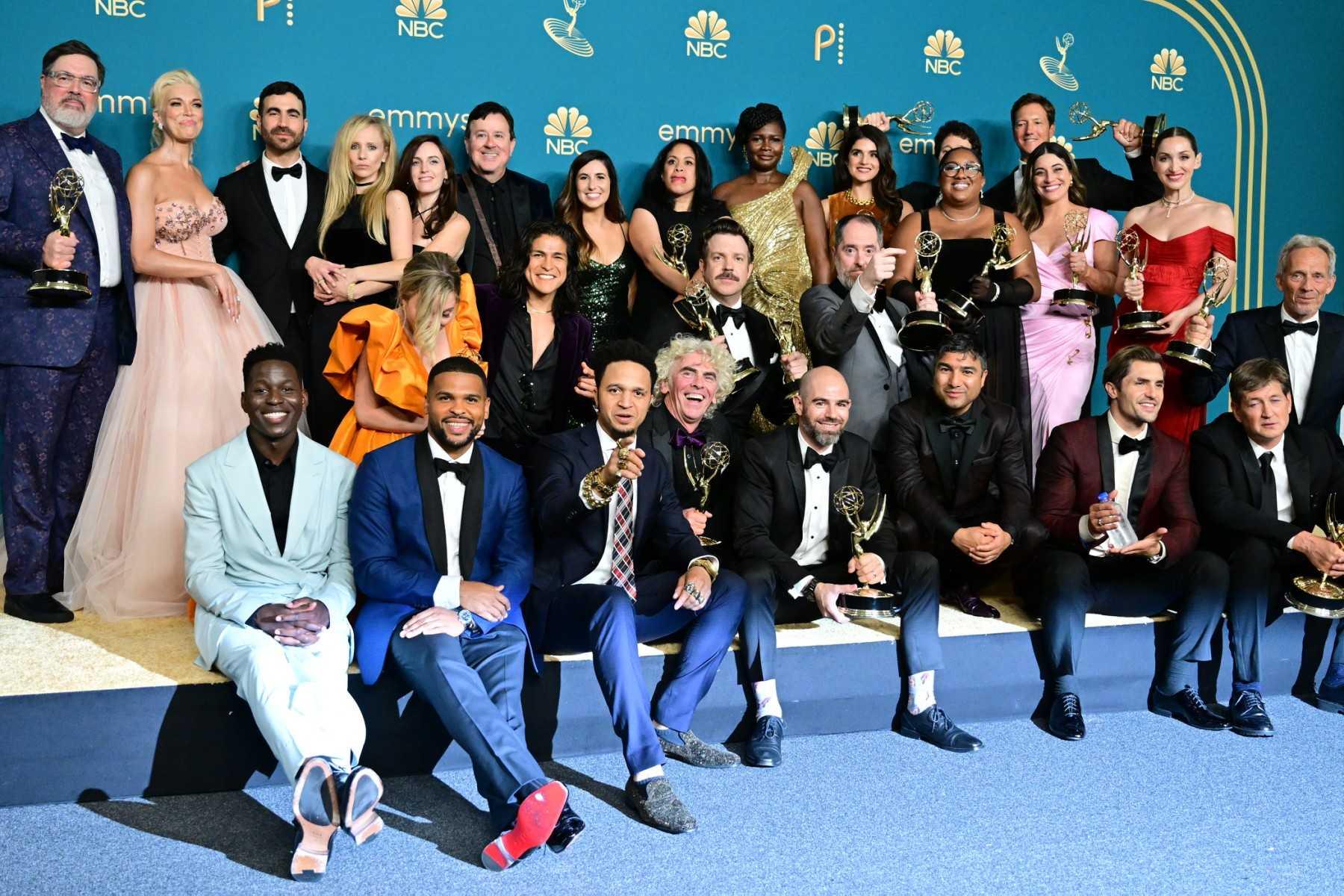 US actor Jason Sudeikis (centre), surrounded by the cast and crew of 'Ted Lasso', poses with the Emmy for Outstanding Comedy Series during the 74th Emmy Awards at the Microsoft Theater in Los Angeles, California, on Sept 12. Photo: AFP