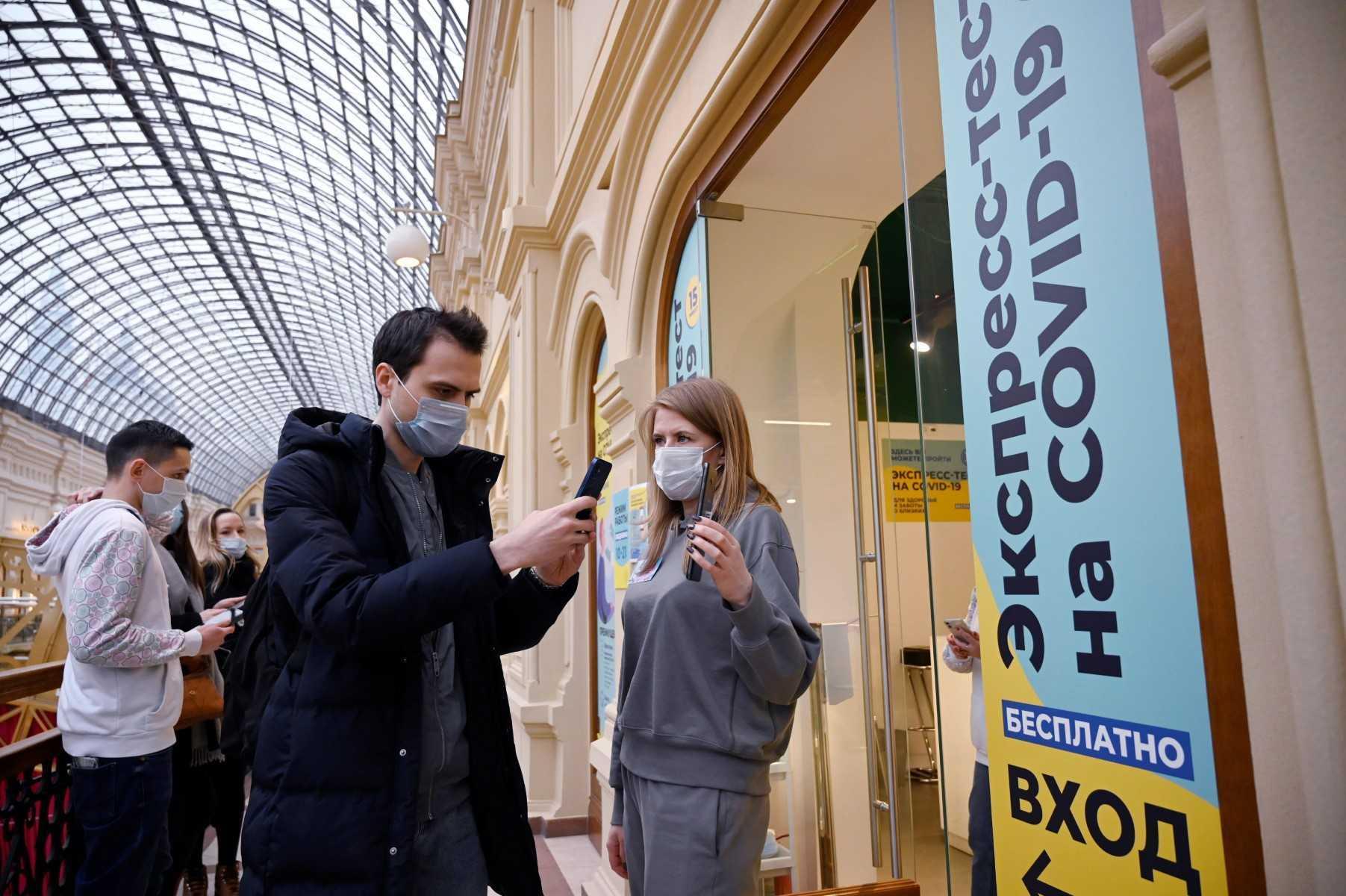 People wait to undergo a free rapid antigen test for Covid-19 at a testing centre in the GUM state department store in Moscow on Jan 31. Photo: AFP