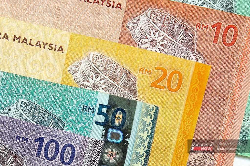 The ringgit slid to 4.5200/5220 against the US dollar this morning from 4.5070/5085 at yesterday’s close.