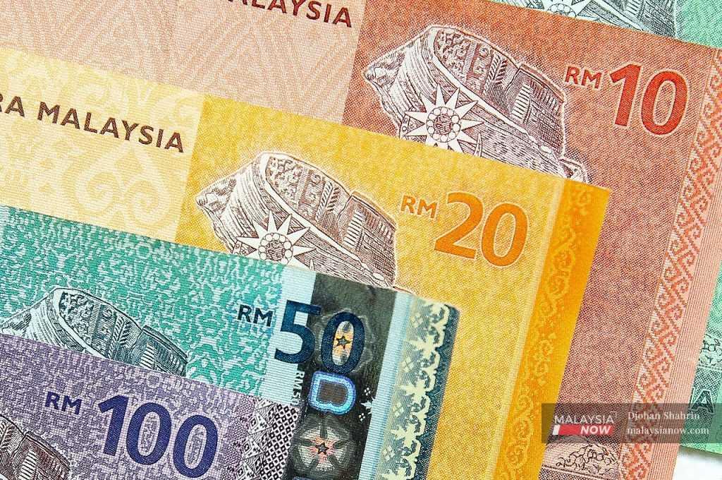 The ringgit slid to 4.5200/5220 against the US dollar this morning from 4.5070/5085 at yesterday’s close.