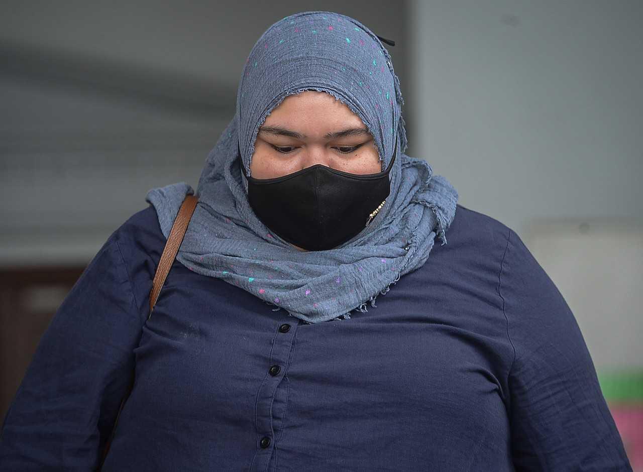Rumah Bonda founder Siti Bainun Ahd Razali leaves the Kuala Lumpur court complex yesterday. Photo: Bernama