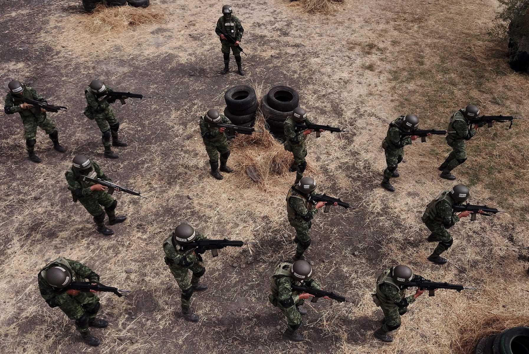 Aerial view of members of the Mexican Army maneuvering Mexican-made FX-05 Xiuhcoatl rifles during a special forces training at Los Capulines military base in the V military region in Jamay, Jalisco state, Mexico, on Jan 21. Photo: AFP