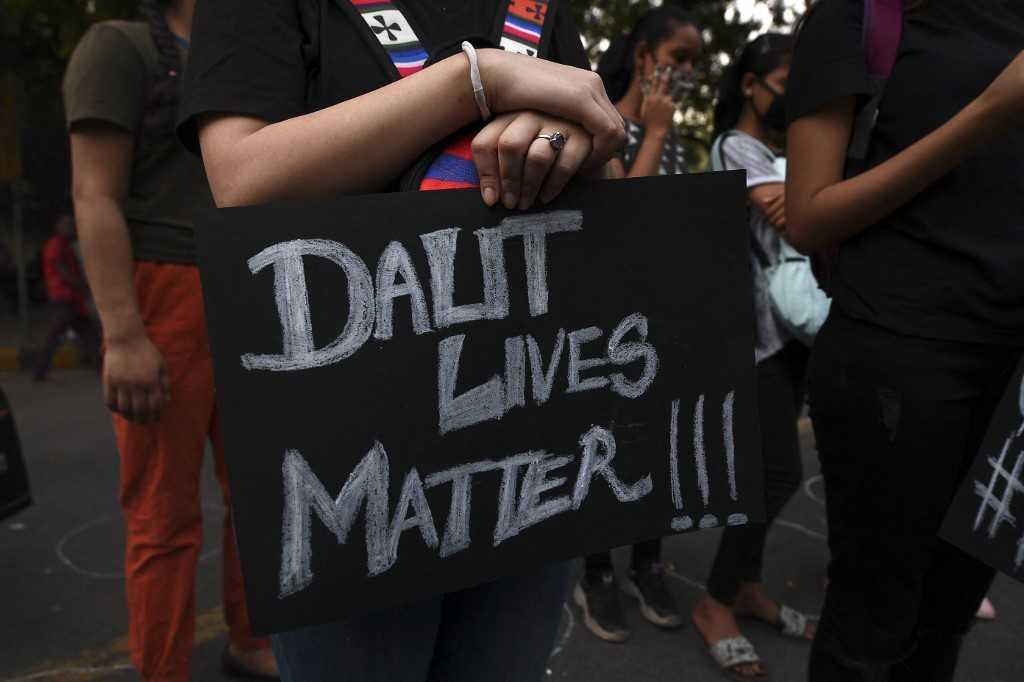A demonstrator holds a placard reading 'Dalit Lives Matter' during a protest against the alleged gang-rape and murder of a 19-year-old woman in Uttar Pradesh state, in New Delhi on Oct 4, 2020. Violence against women, especially those from lower castes, is endemic in India, where several still follow an ancient caste system. Photo: AFP