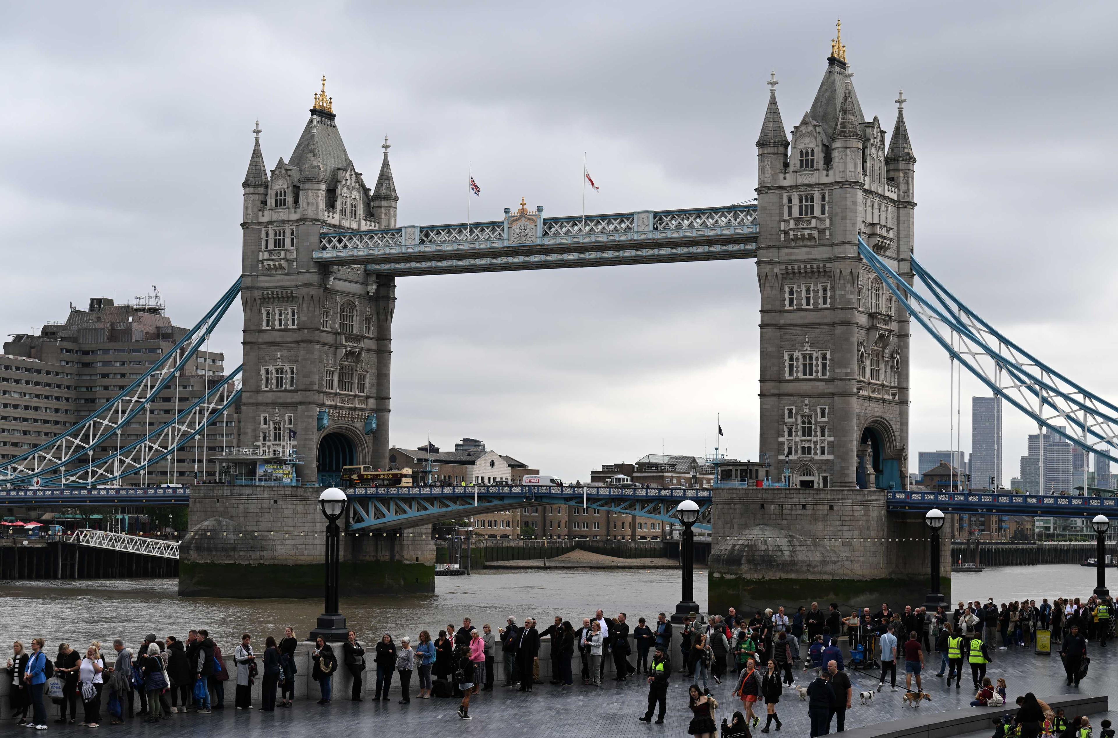 Members of the public stand in the queue on the South Bank of the River Thames, alongside Tower Bridge, as they wait in line to pay their respects to the late Queen Elizabeth II, in London on Sept 15. Photo: AFP 