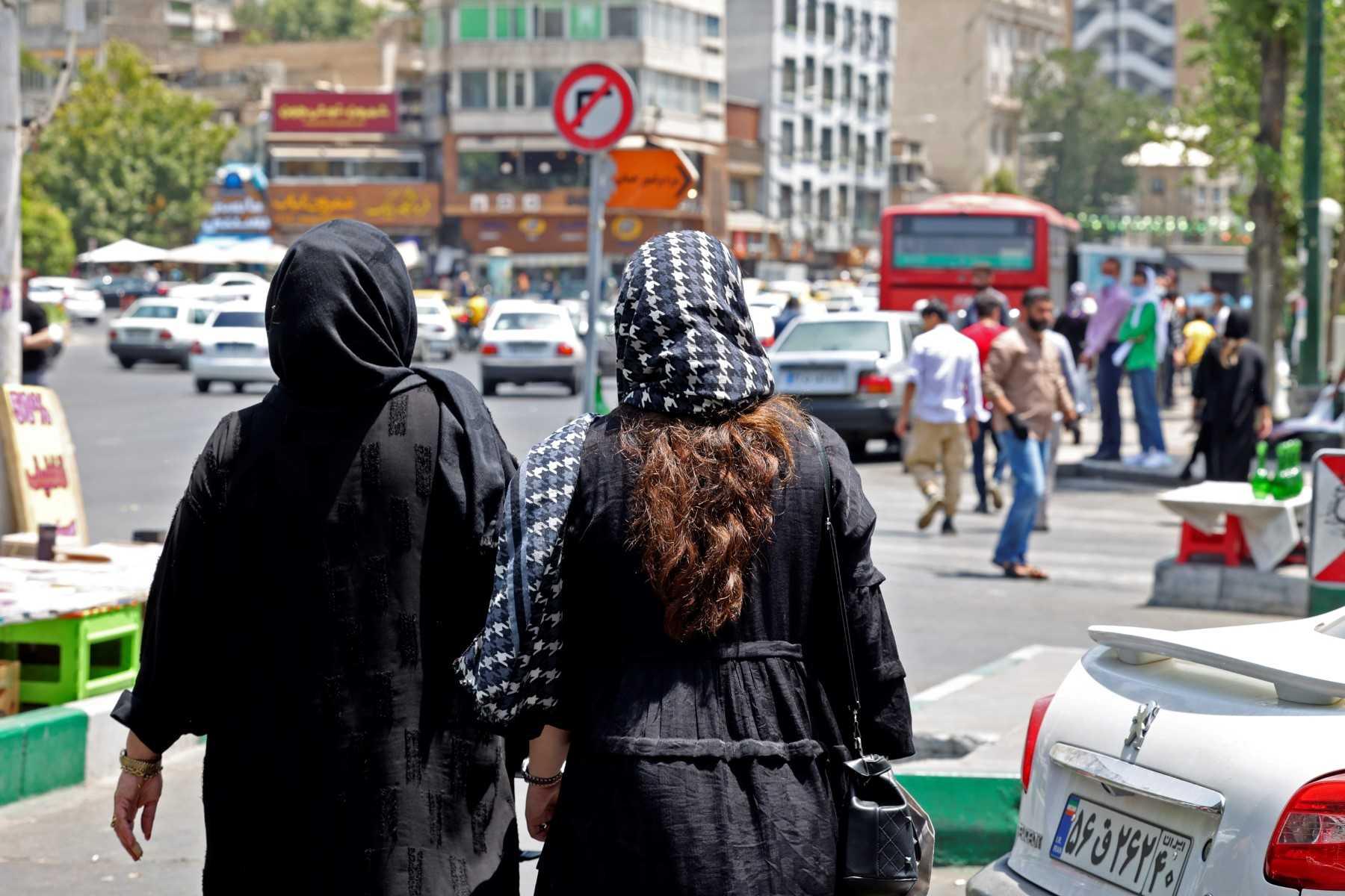 Women wearing headscarves walk in the streets of Tehran near, Tajrish Square, on July 12. Iranian law requires all women, regardless of nationality or religious belief, to wear a hijab that covers the head and neck while concealing the hair although many have pushed the boundaries over the years. Photo: AFP
