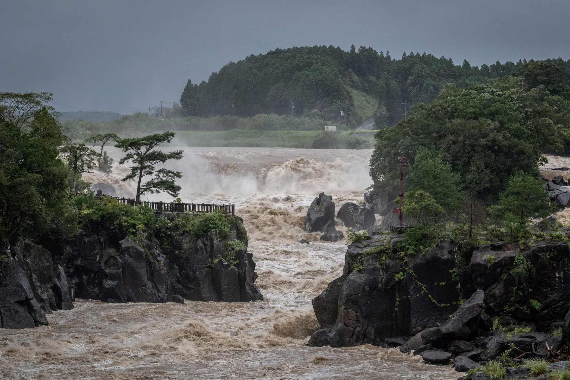Raging waters flow along the Sendai River in the wake of Typhoon Nanmadol in Isa, Kagoshima prefecture on Sept 19. Photo: AFP
