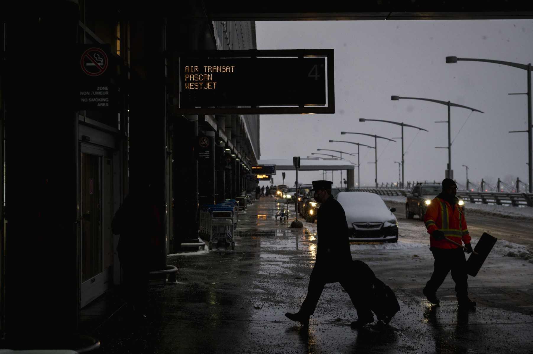 An airline pilot walks into Montréal-Pierre Elliott Trudeau International Airport in Montreal, Quebec on Jan 17. Photo: AFP