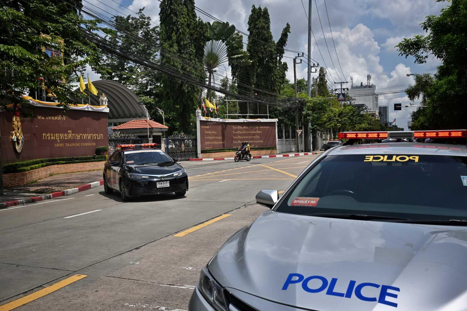 This picture shows police cars parked in Bangkok on Sept 14. Tun Min Latt, was arrested in Bangkok in a raid along with three Thai nationals on charges of conspiracy to traffic narcotics and money laundering, Thailand's deputy police spokesman says. Photo: AFP