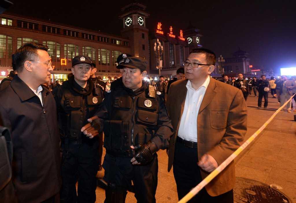 This picture taken on May 6, 2014 shows then Chinese deputy minister of public security Fu Zhenghua (centre) speaking at the Beijing railway station as security was stepped up after a series of attacks in the country. Photo: AFP