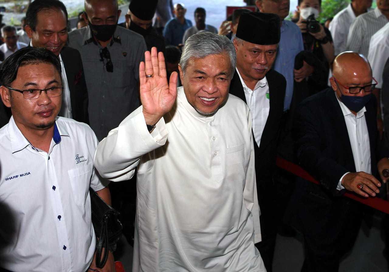 Former home minister Ahmad Zahid Hamidi waves upon his arrival at the Shah Alam High Court. Photo: Bernama
