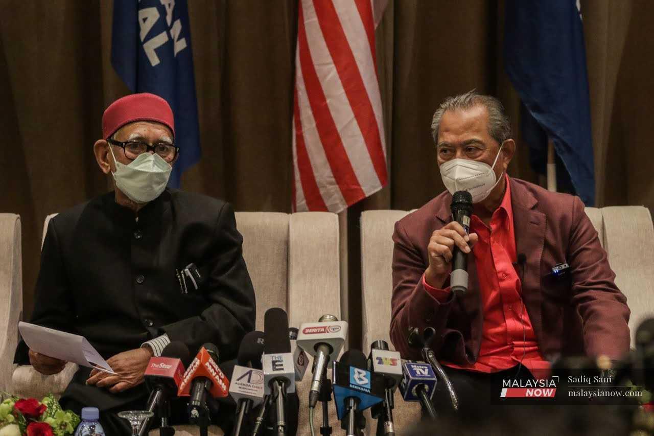 Bersatu president Muhyiddin Yassin with PAS leader Abdul Hadi Awang at a press conference following the retreat between the two parties earlier this year. 