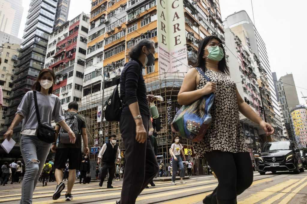 People cross a street in Hong Kong in this May 13 photo. Photo: AFP