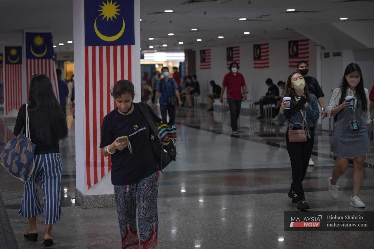 Commuters make their way through KL Sentral in the capital city of Kuala Lumpur. 