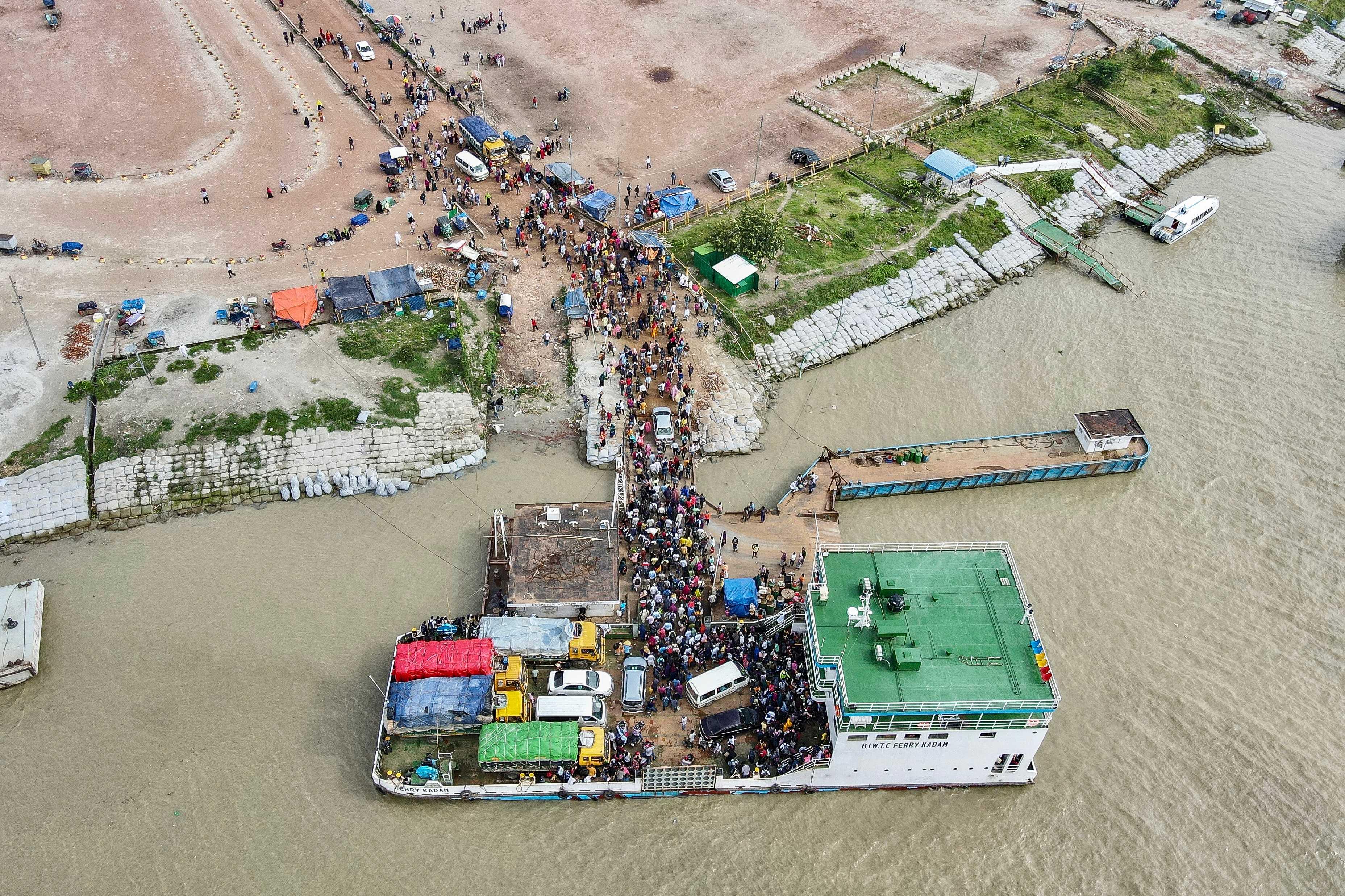 This aerial photograph taken on July 31, 2021 shows people disembark from a ferry in Sreenagar. Photo: AFP 