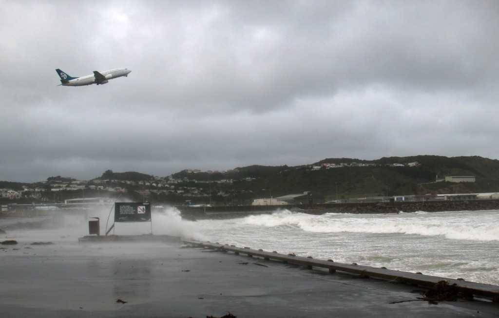 A plane takes off at Wellington Airport after a major storm which disrupted flights across New Zealand on June 21, 2013. Photo: AFP 