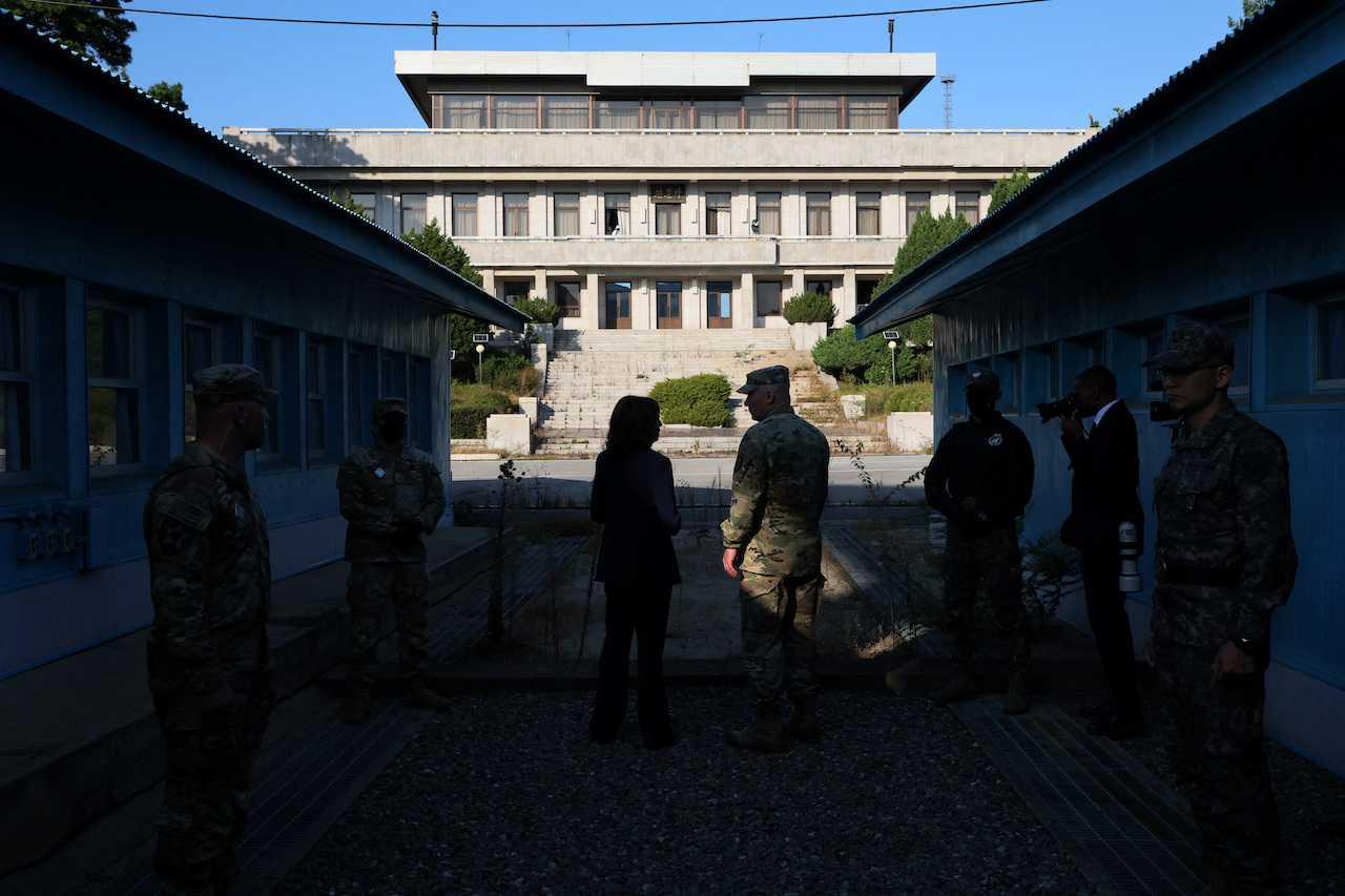 US Vice-President Kamala Harris is briefed by a member of the military as they stand at the demarcation line facing North Korea in the demilitarised zone separating the two Koreas, in Panmunjom, South Korea, Sept 29. Photo: Reuters