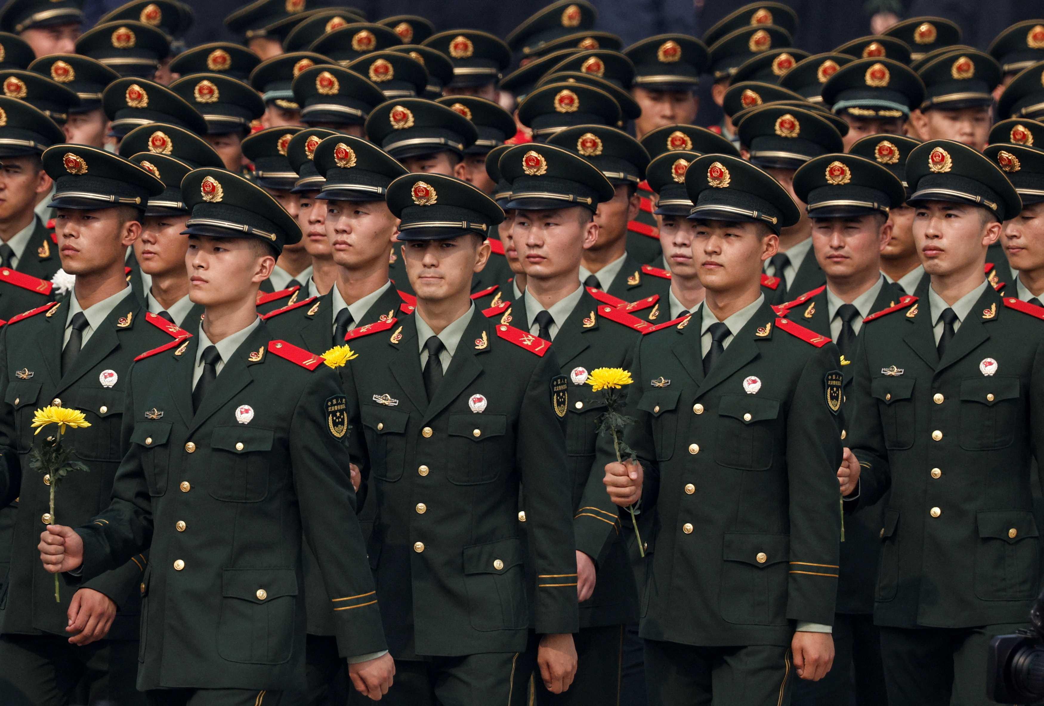 Members of China's military attend a wreath laying ceremony on Tiananmen Square to mark Martyrs' Day on the eve of the National Day in Beijing, China Sept 30. Photo: Reuters