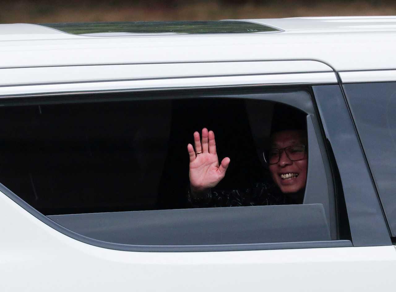 Prime Minister Ismail Sabri Yaakob waves as he arrives at Istana Negara for an audience with the Yang di-Pertuan Agong in Kuala Lumpur yesterday. Photo: Reuters
