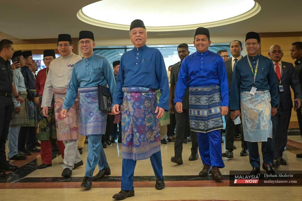 Prime Minister Ismail Sabri Yaakob with Finance Minister Tengku Zafrul Aziz upon their arrival at the Parliament building for the 2023 budget presentation on Oct 7.