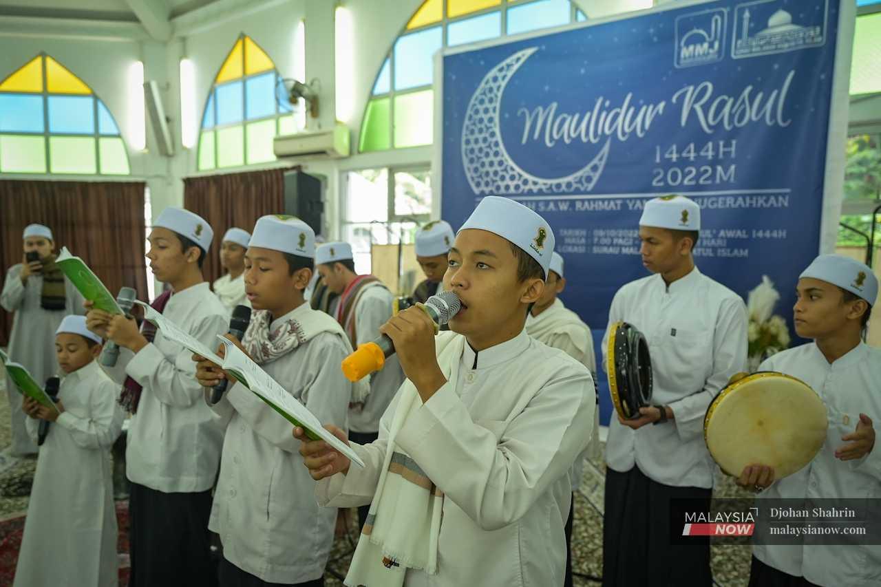 A group of Tahfiz students are invited to give a religious reading as part of the presentations.