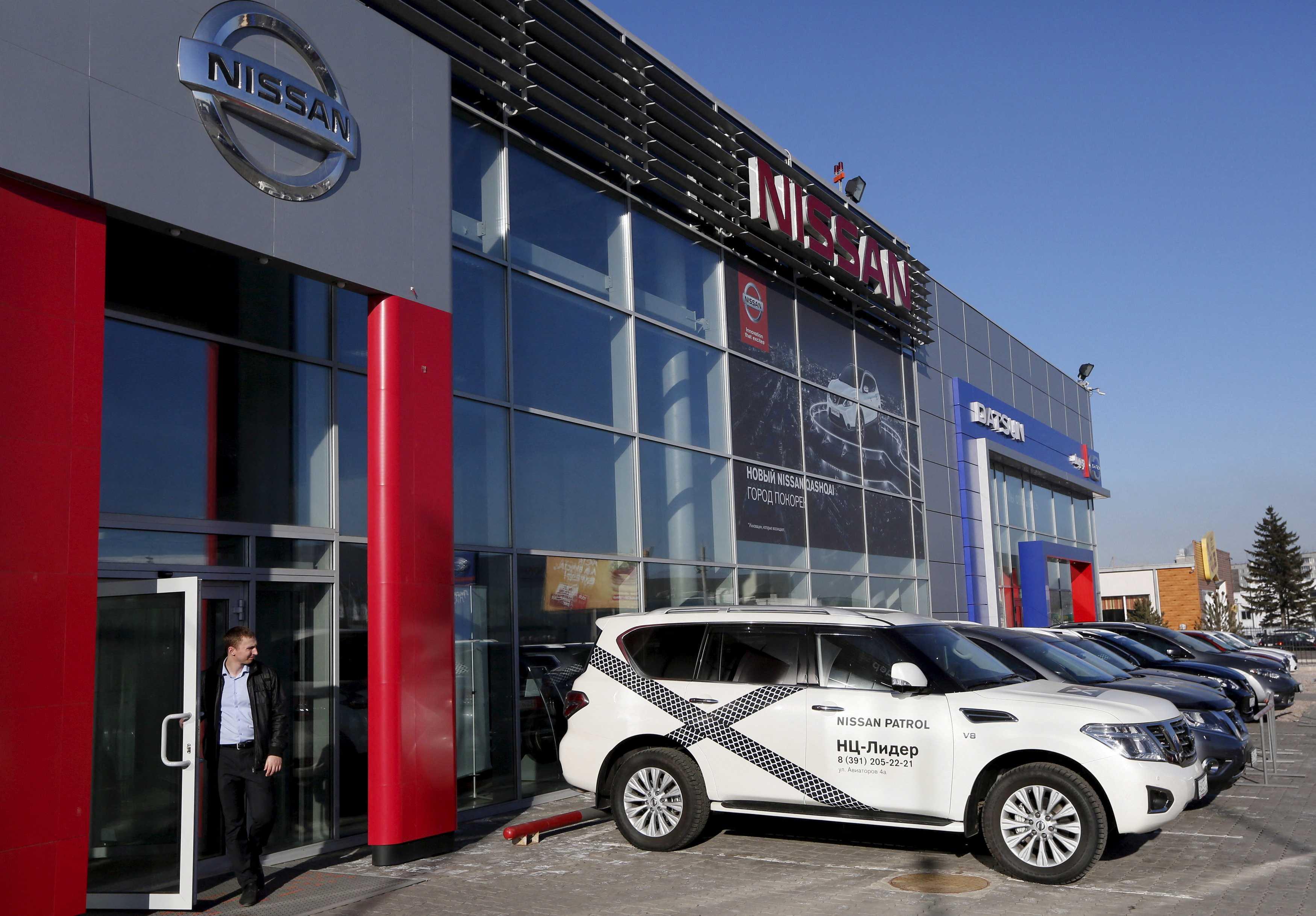 A man walks out of Nissan and Datsun showroom in Russia's Siberian city of Krasnoyarsk March 30, 2015. Photo: Reuters