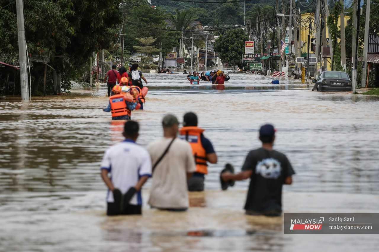 Residents are evacuated following the massive floods that submerged Hulu Langat in Selangor last December. 

