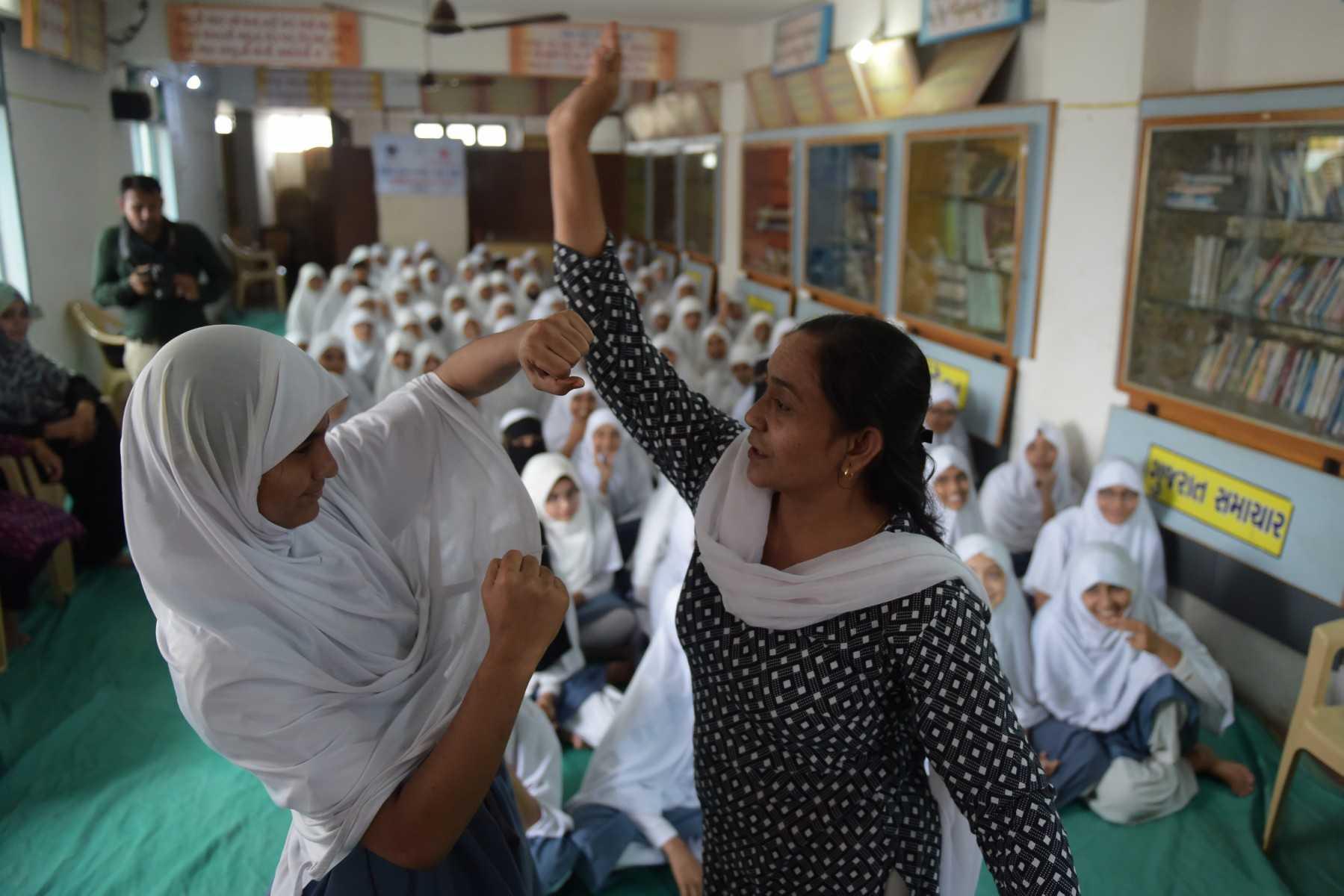 School students take part in a self-defence workshop at a school in Ahmedabad on July 21. Photo: AFP 