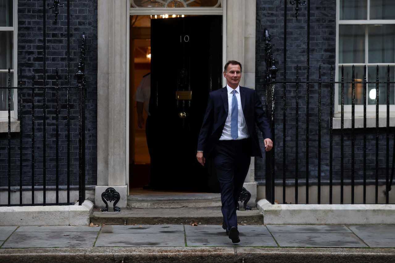 New Chancellor of the Exchequer Jeremy Hunt leaves 10 Downing Street in London, Britain, Oct 14. Photo: Reuters