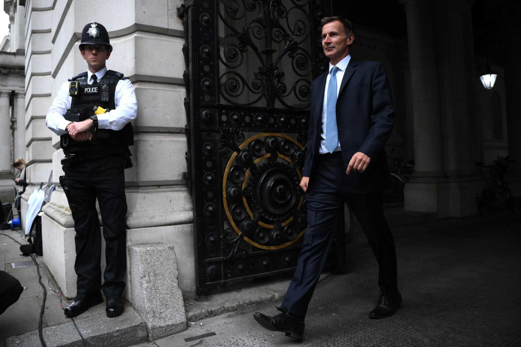 Britain's new Chancellor of the Exchequer Jeremy Hunt arrives in Downing Street in central London on Oct 14. Photo: AFP