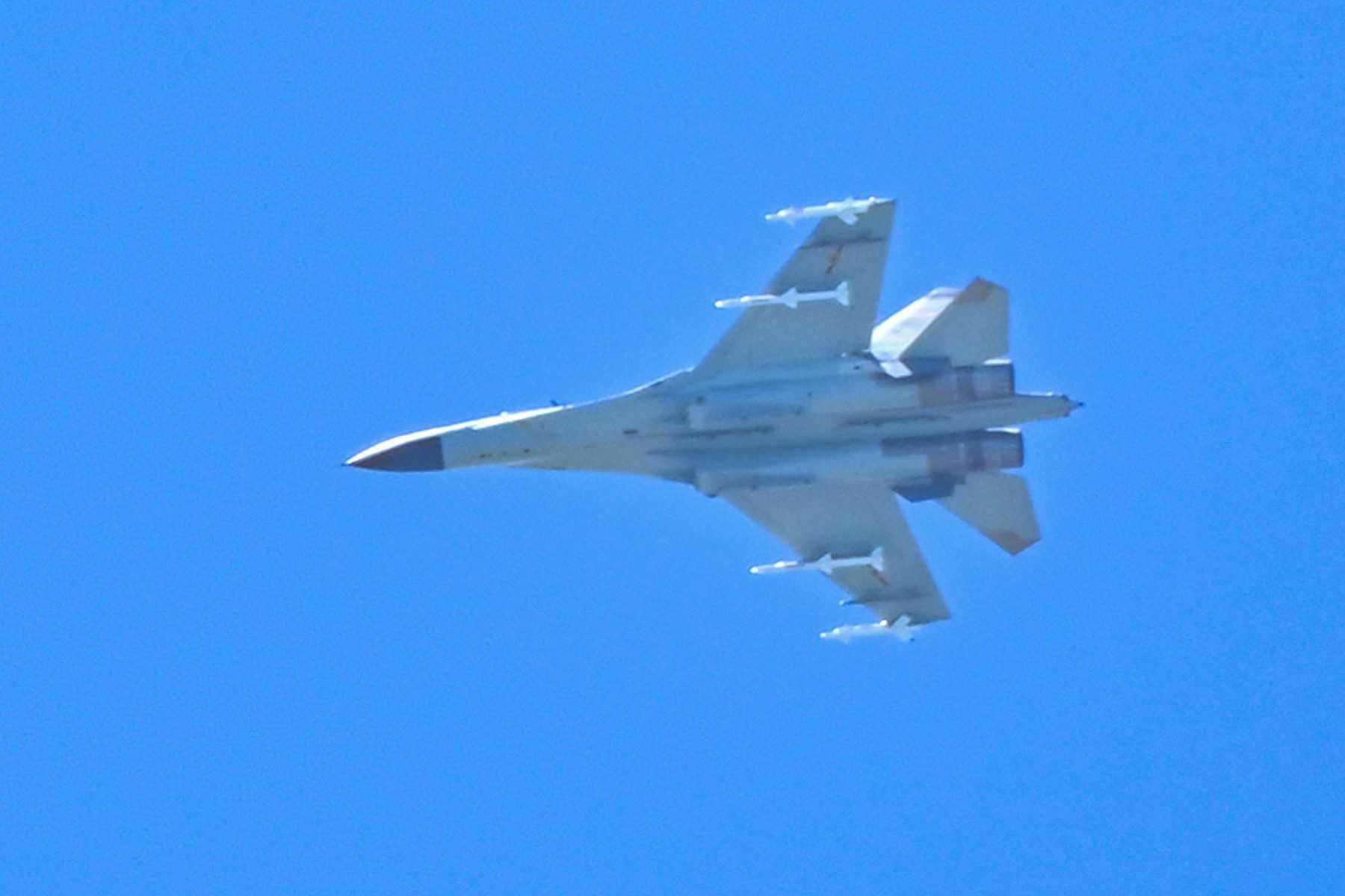 A Chinese military jet flies over Pingtan island, one of mainland China's closest point from Taiwan, in Fujian province on Aug 5. Photo: AFP