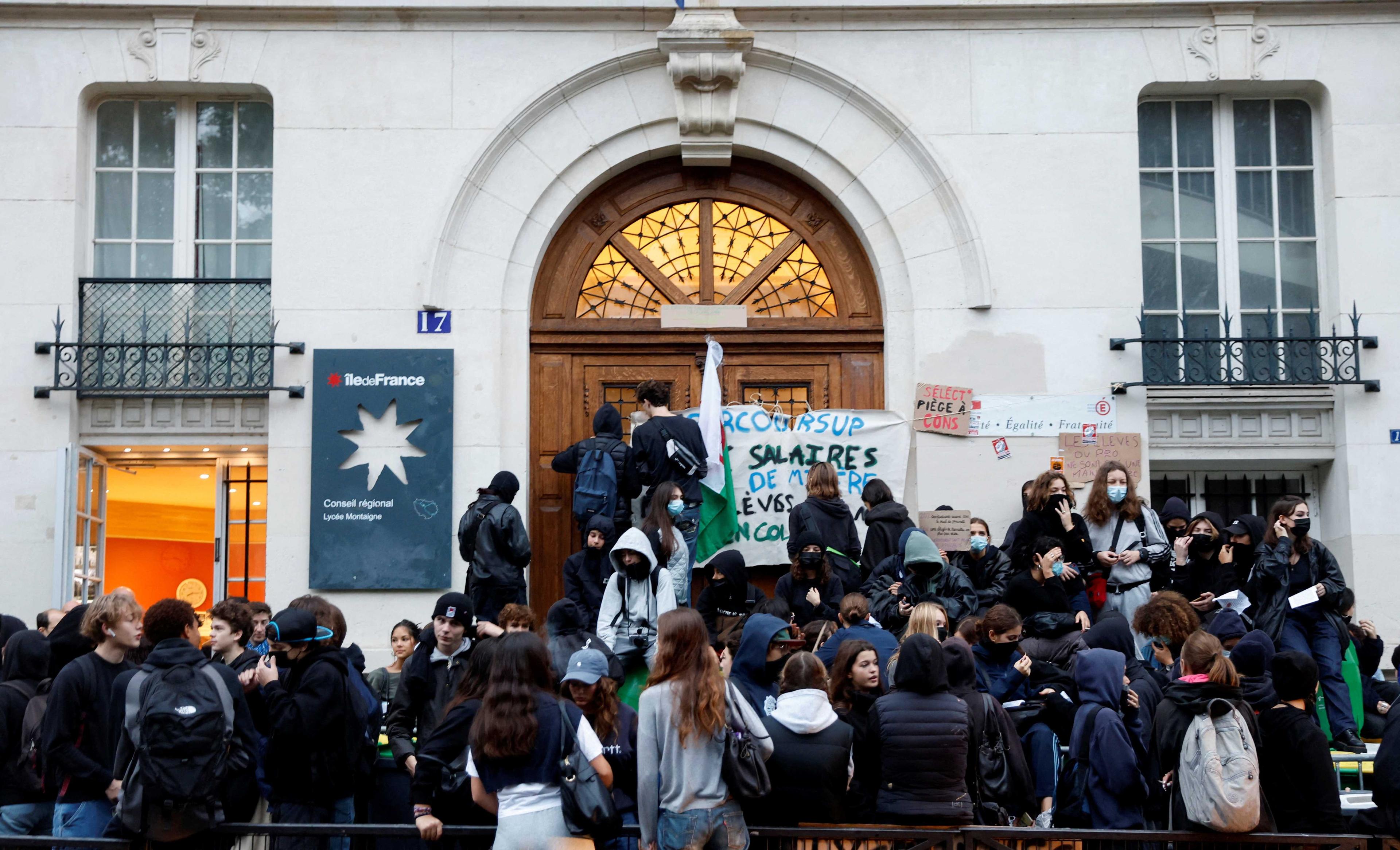 French students block the entrance of the Lycee Montaigne high school to protest as part of a nationwide day of strike in Paris, France, Oct 18. Photo: Reuters