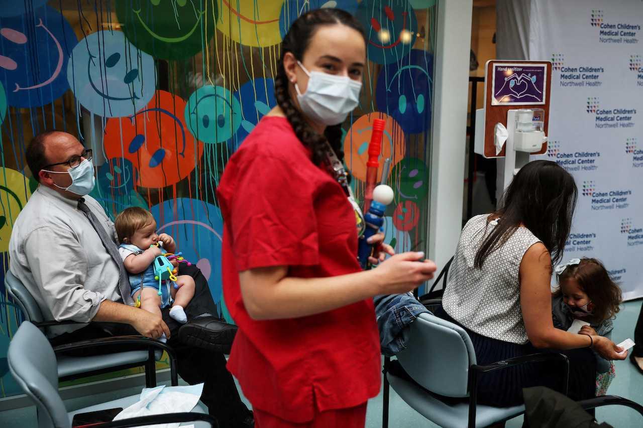Parents wait for their children to receive the vaccine against Covid-19 at a medical centre in New Hyde Park, New York, US, June 22. Photo: Reuters