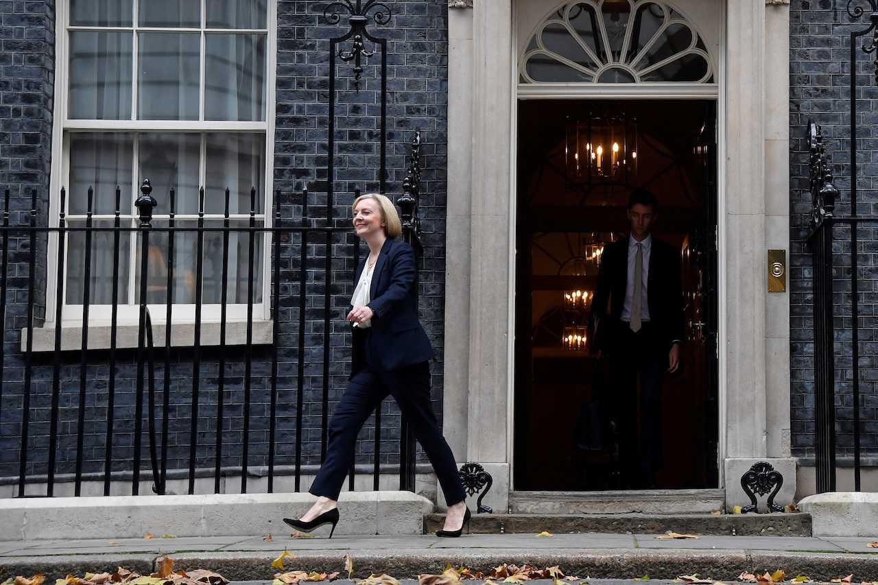 Liz Truss leaves Number 10 Downing Street for the Houses of Parliament, in London, Britain, Oct 19. Photo: Reuters