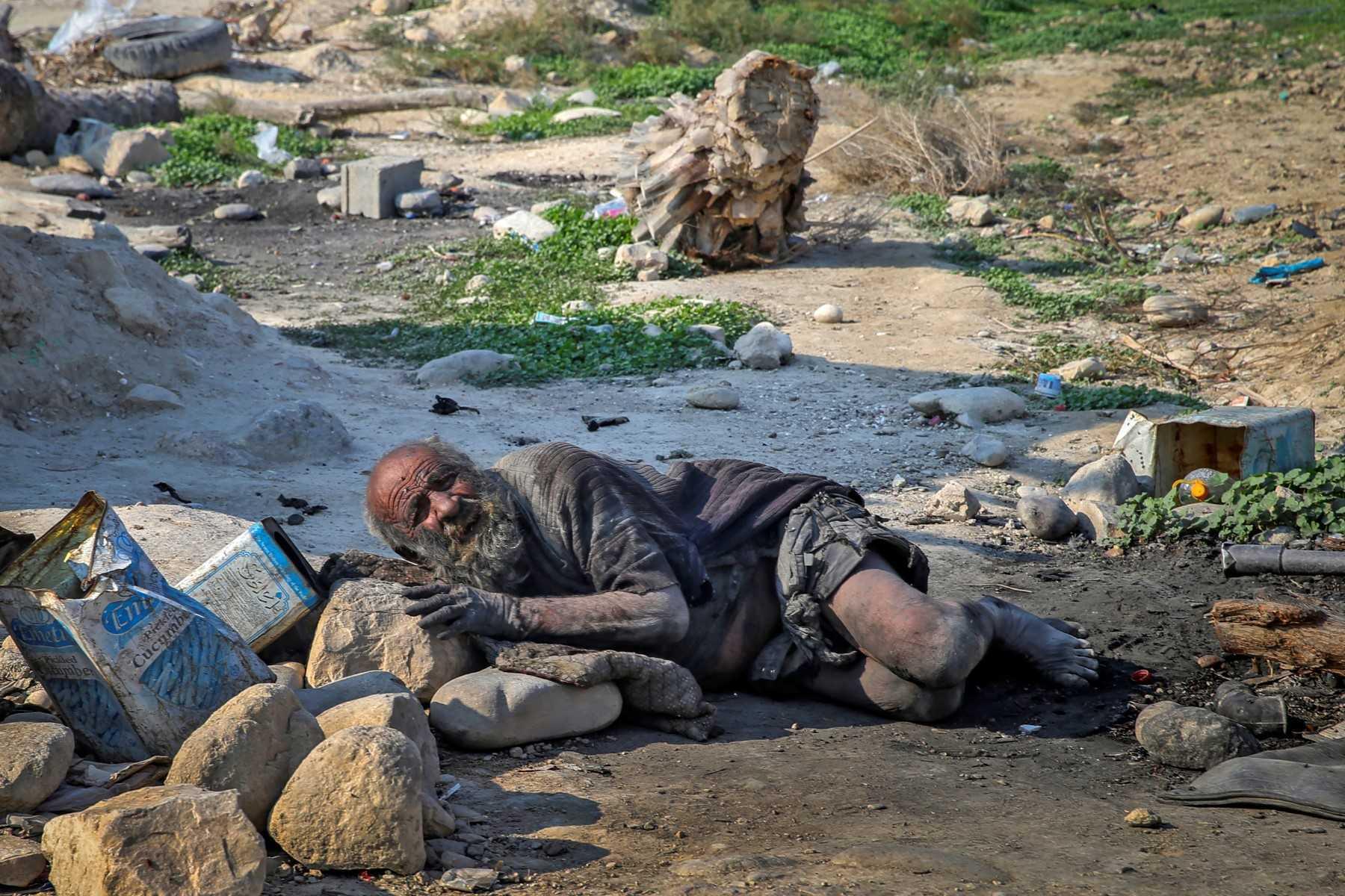 In this file photo taken on Dec 28, 2018, Amou Haji lies on the ground on the outskirts of the village of Dezhgah in the Dehram district of the southwestern Iranian Fars province. Photo: AFP