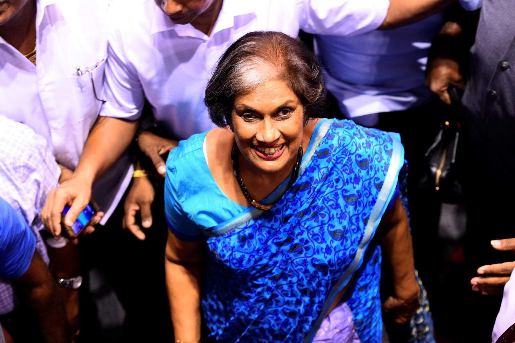 Sri Lanka's former president Chandrika Kumaratunga (centre) walks among supporters during a rally in Colombo on Nov 5, 2019. Photo: AFP