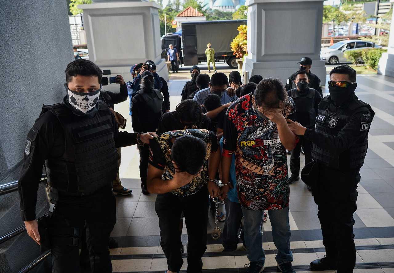 The initial 11 suspects arrested over the kidnap of Palestinian Omar ZM Albelbaisy Raeda at the Kuala Lumpur Magistrate's Court on Oct 14. Photo: Bernama