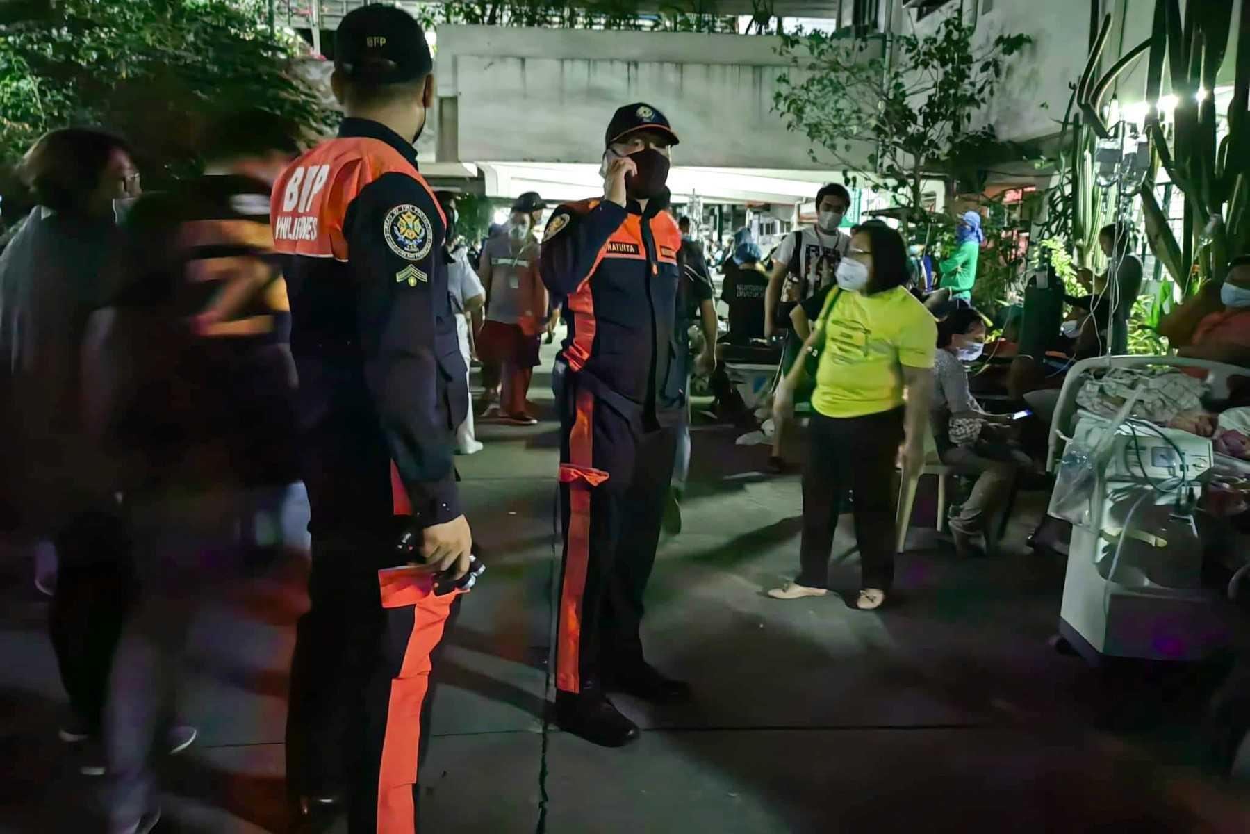 This handout photo taken and released by the Bureau of Fire Protection shows rescue teams conducting an inspection at Mariano Marcos Memorial Hospital in Batac city, Ilocos Norte on Oct 25, after a 6.4-magnitude earthquake hit the northern Philippines. Photo: AFP 