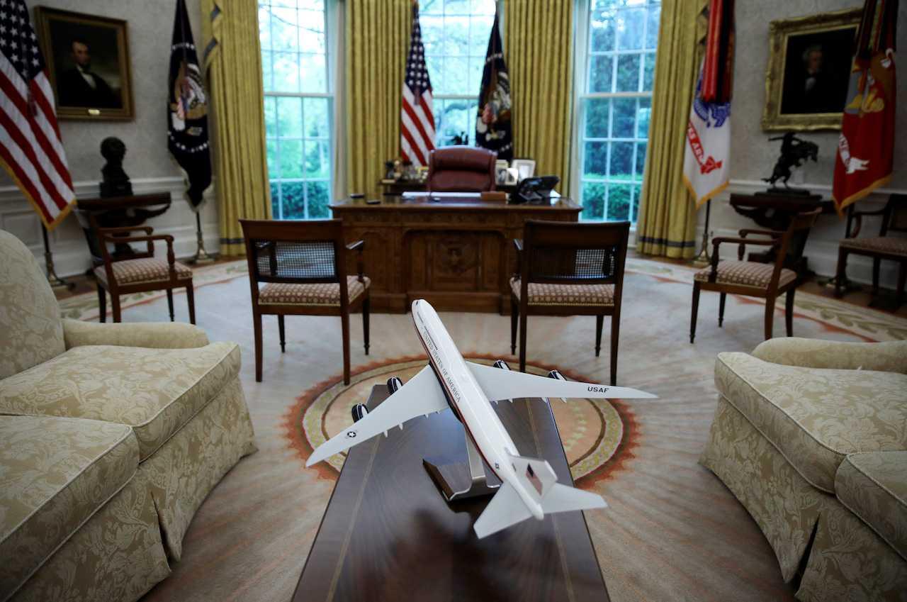 A scale model of the next version of the Air Force One presidential airplane is seen in an empty Oval Office at the White House in Washington, US, April 29, 2020. Photo: Reuters