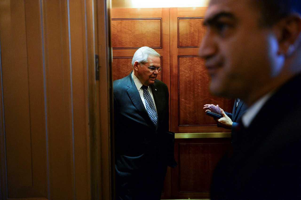 Senator Robert Menendez speaks to a reporter in an elevator at the US Capitol in Washington, Sept 28. Photo: Reuters