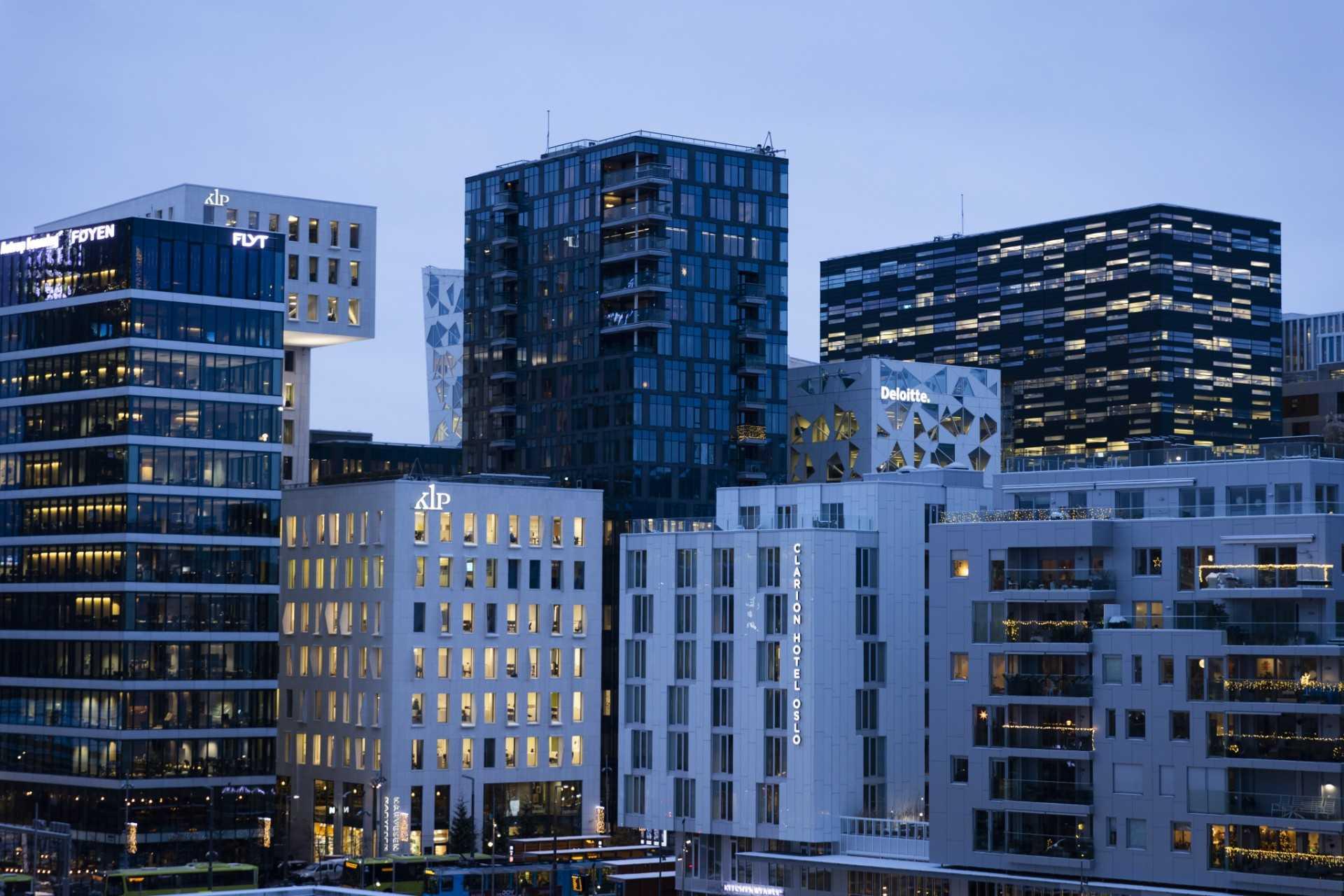 Office buildings are seen along the eastern waterfront in central Oslo on Dec 9, 2021. Photo: AFP