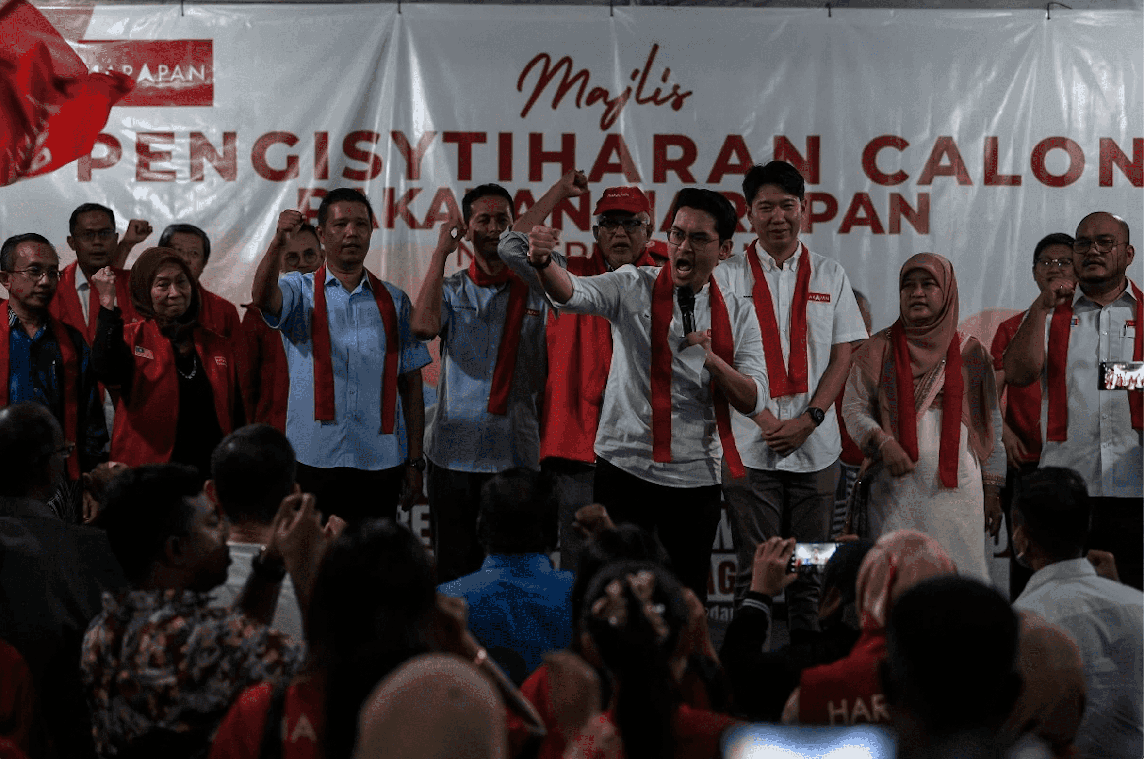 Sungai Petani candidate Mohammed Taufiq Johari gestures alongside other Pakatan Harapan candidates announced for parliamentary seats in Kedah last night. Photo: Bernama