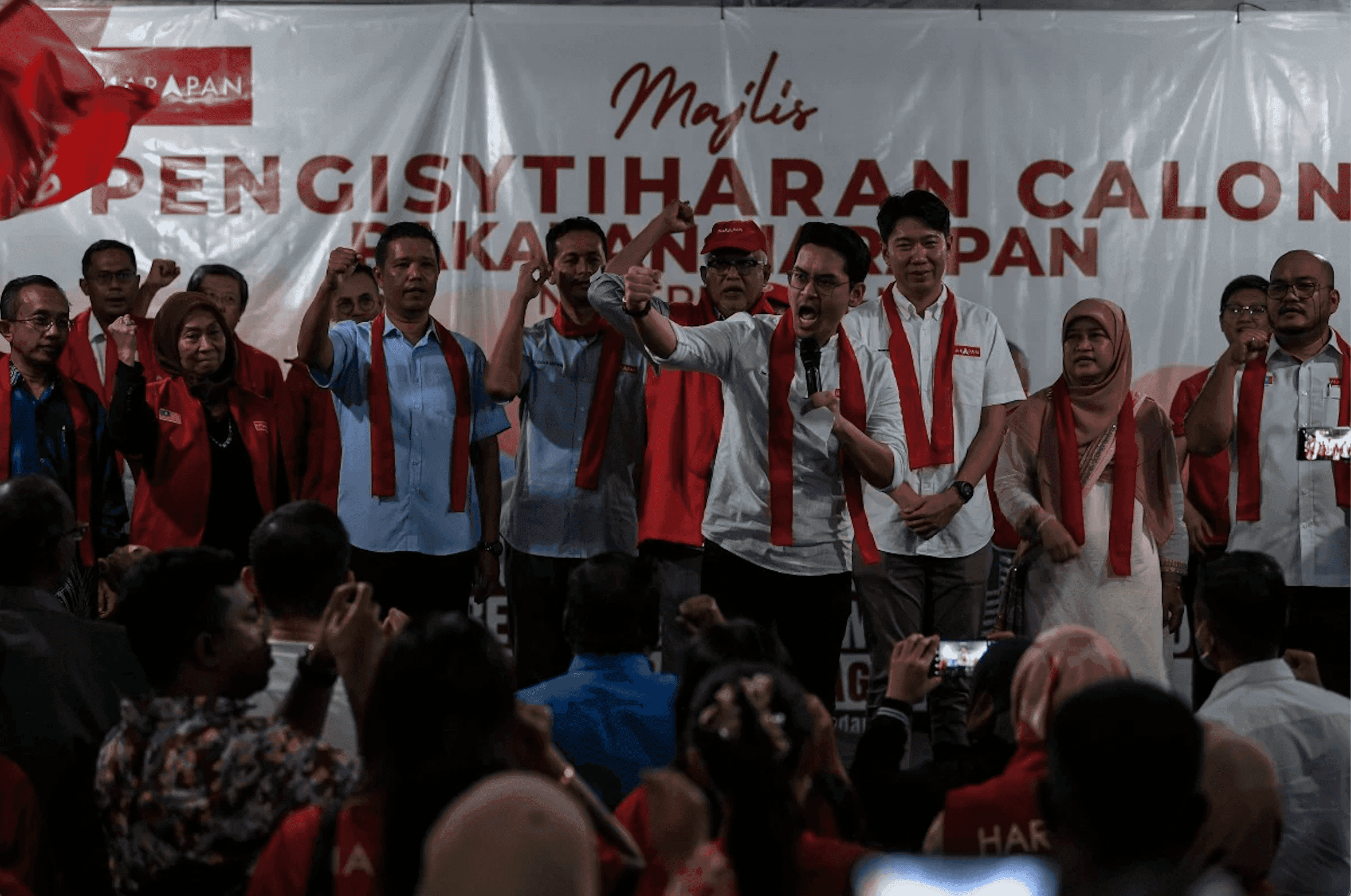 Sungai Petani candidate Mohammed Taufiq Johari gestures alongside other Pakatan Harapan candidates announced for parliamentary seats in Kedah last night. Photo: Bernama 
