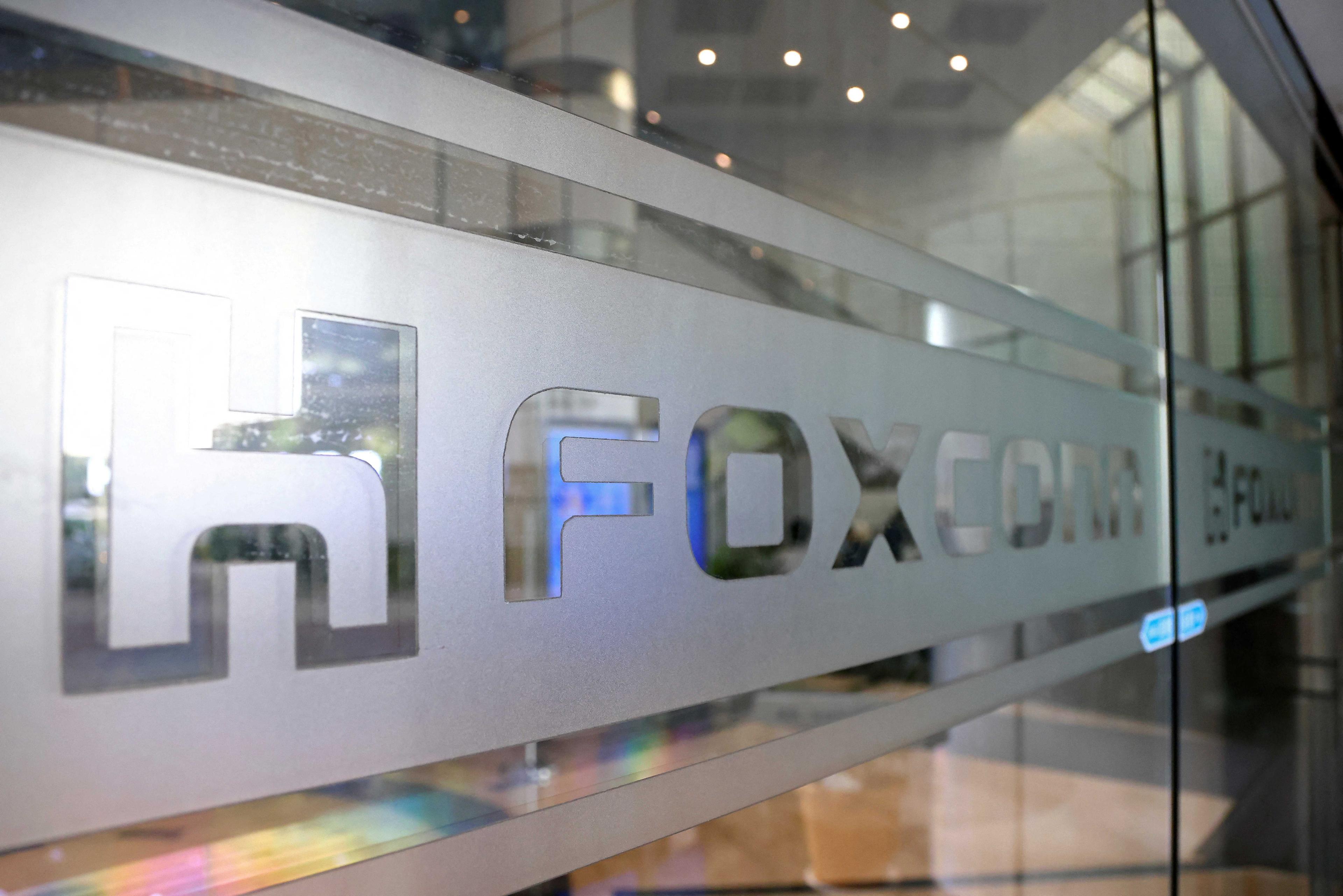 A sign of Foxconn is seen at a glass door inside its office building in Taipei, Taiwan Nov 12, 2020. Photo: Reuters