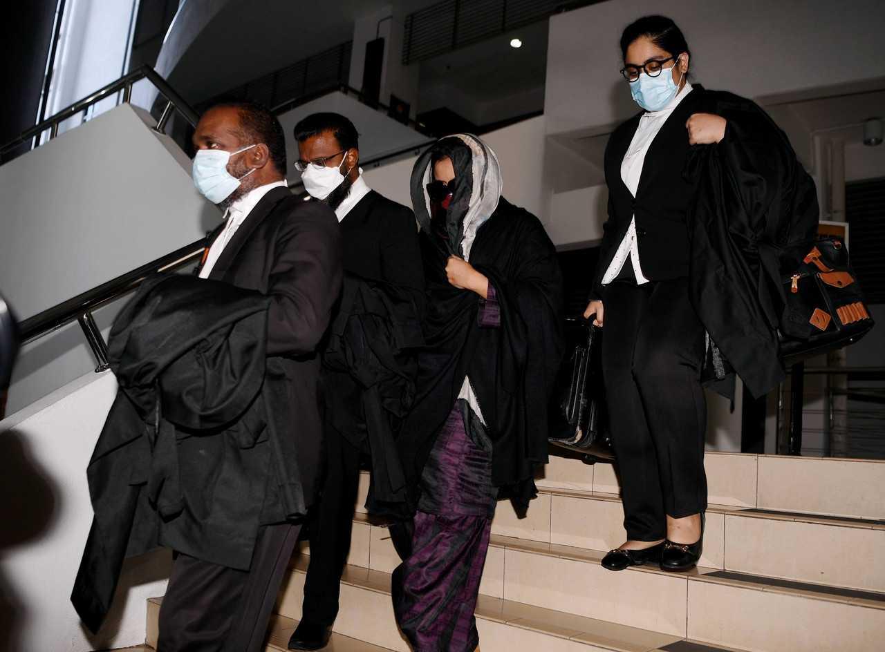 Samirah Muzaffar (second right), the widow of Cradle Fund CEO Nazrin Hassan, leaves the Shah Alam High Court after being acquitted of his murder on June 21. Photo: Bernama