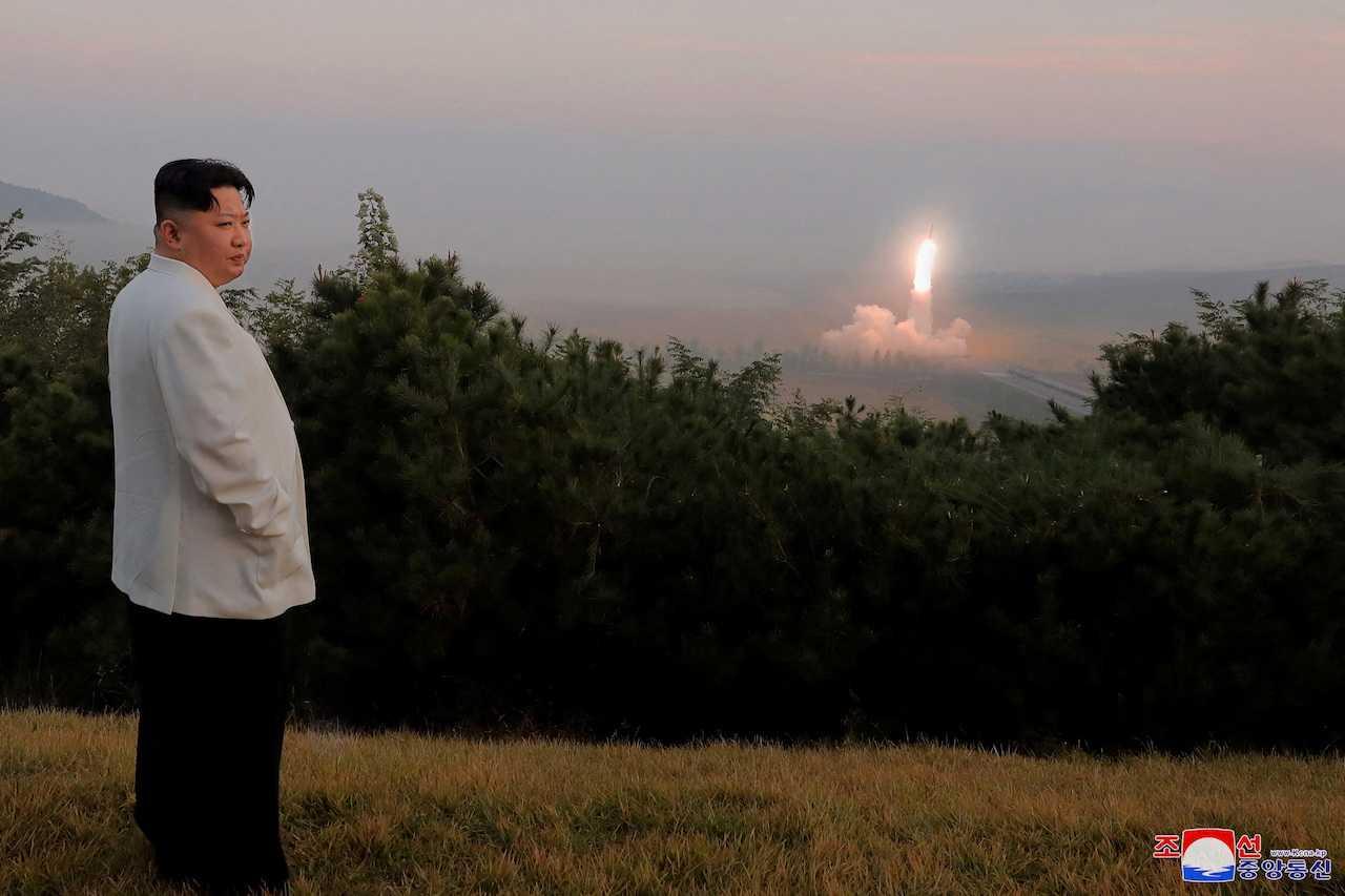 North Korea's leader Kim Jong Un oversees a missile launch at an undisclosed location in North Korea, in this undated photo released on Oct 10 by North Korea's Korean Central News Agency. Photo: Reuters