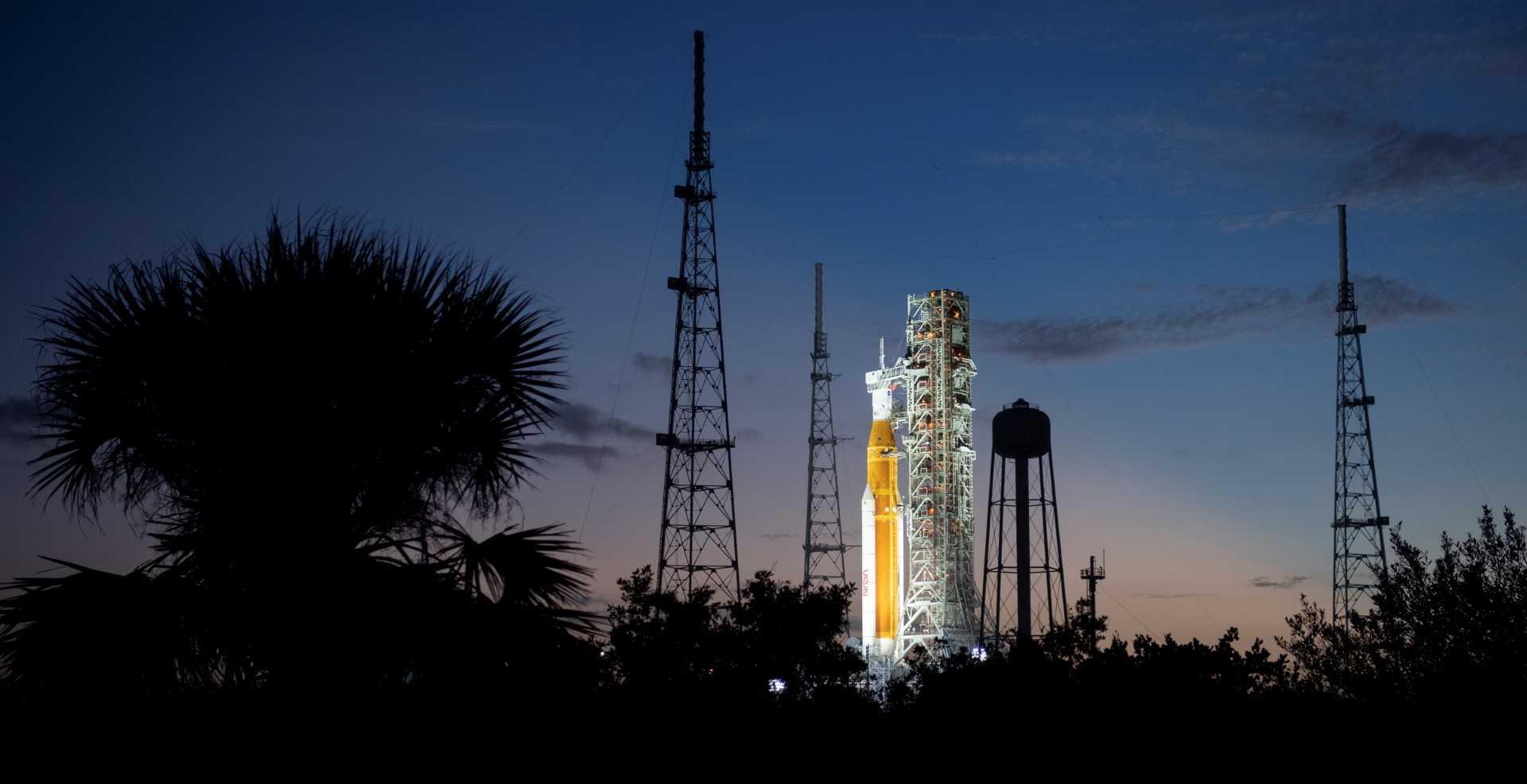 This Nasa handout photo shows Nasa's Space Launch System rocket with the Orion spacecraft aboard illuminated by spotlights after sunset atop the mobile launcher at Launch Pad 39B as preparations for launch continue, Nov 6. Photo: AFP