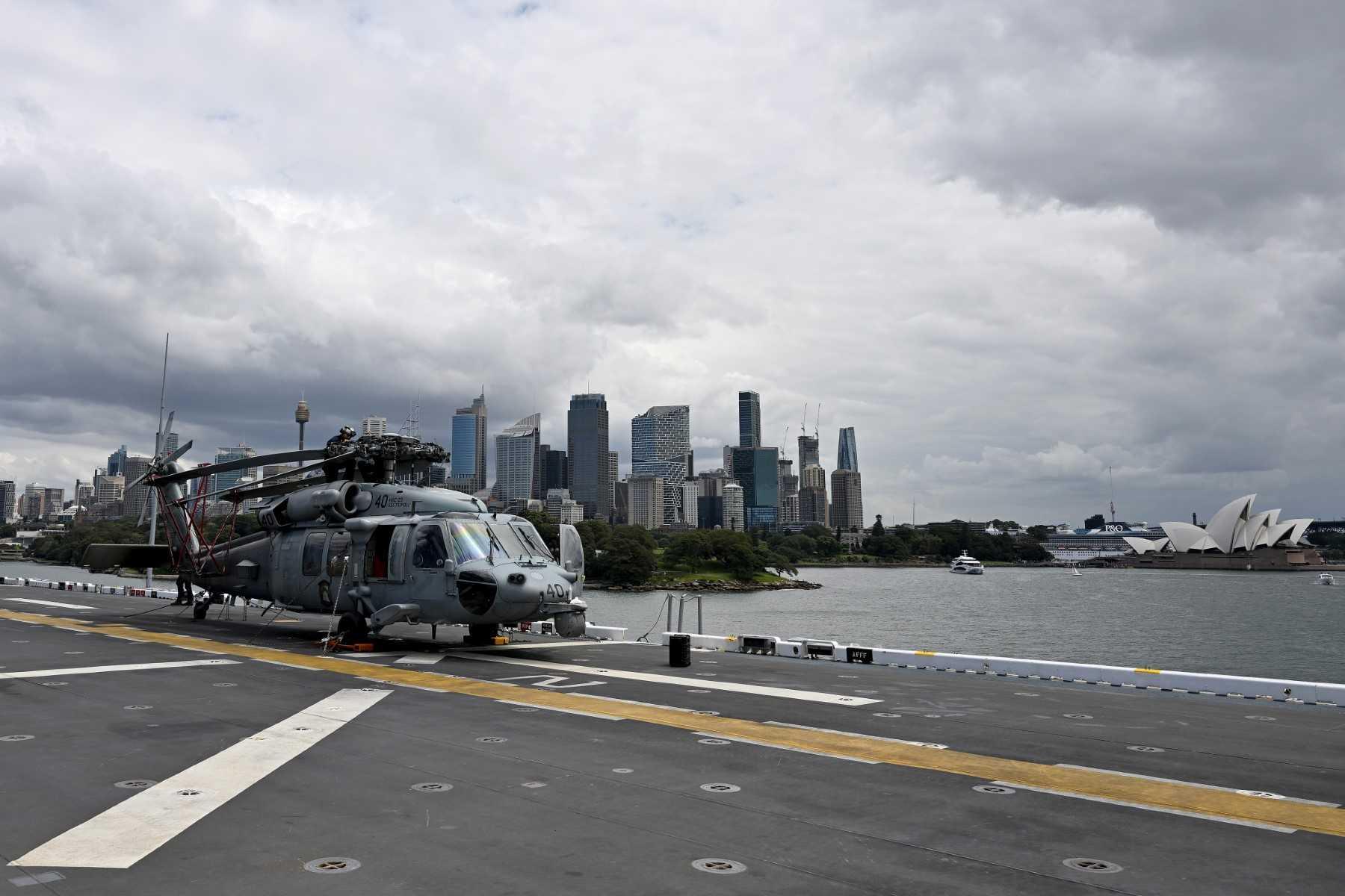 An MH-60 Seahawk flown by Helicopter Sea Combat Squadron 23 is seen on the flight deck of an amphibious assault ship while docked at fleet base in Sydney on Nov 4. Photo: AFP