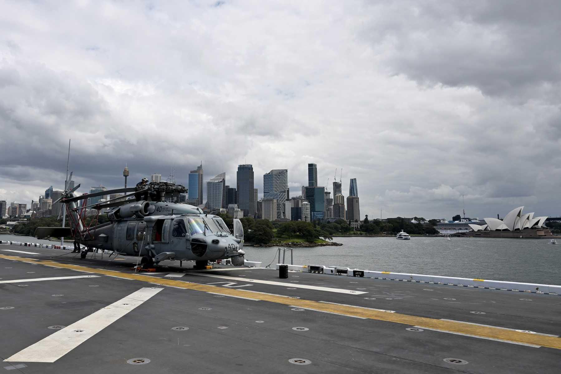 An MH-60 Seahawk flown by Helicopter Sea Combat Squadron 23 is seen on the flight deck of an amphibious assault ship while docked at fleet base in Sydney on Nov 4. Photo: AFP 