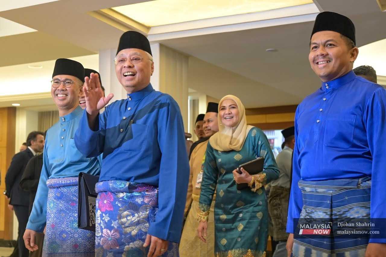 Prime Minister Ismail Sabri Yaakob, flanked by Finance Minister Tengku Zafrul Aziz and his deputies Mohd Shahar Abdullah and Yamani Hafez Musa, waves as he arrives at the Parliament building to present the budget for 2023 on Oct 7. 
